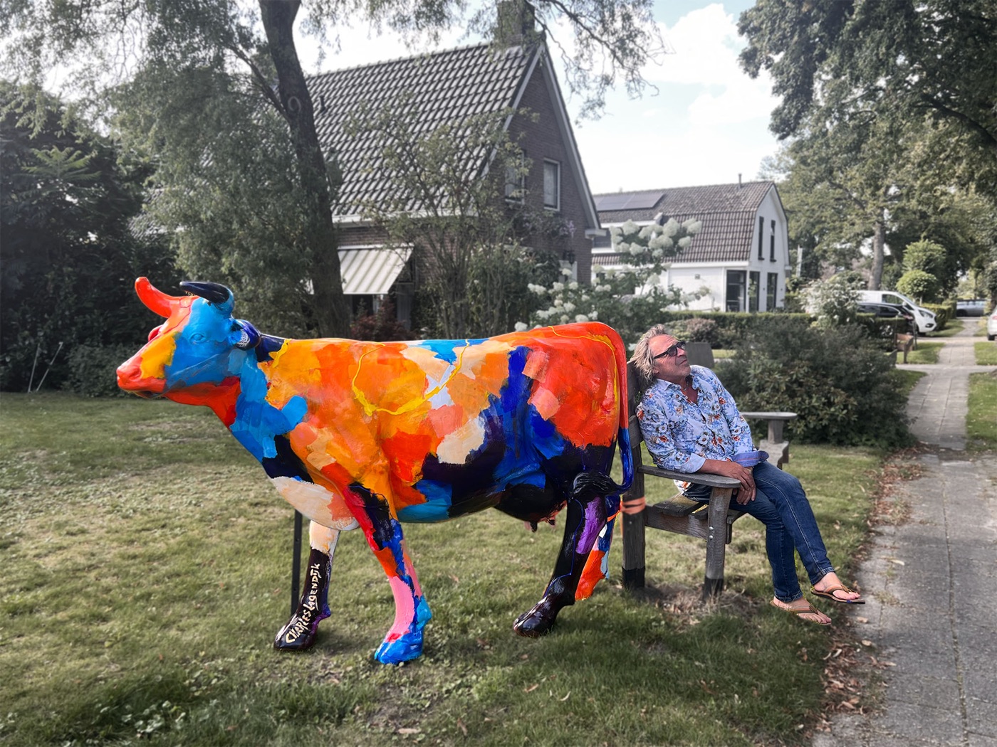 Charles Lagendijk beside one of his painted cows
